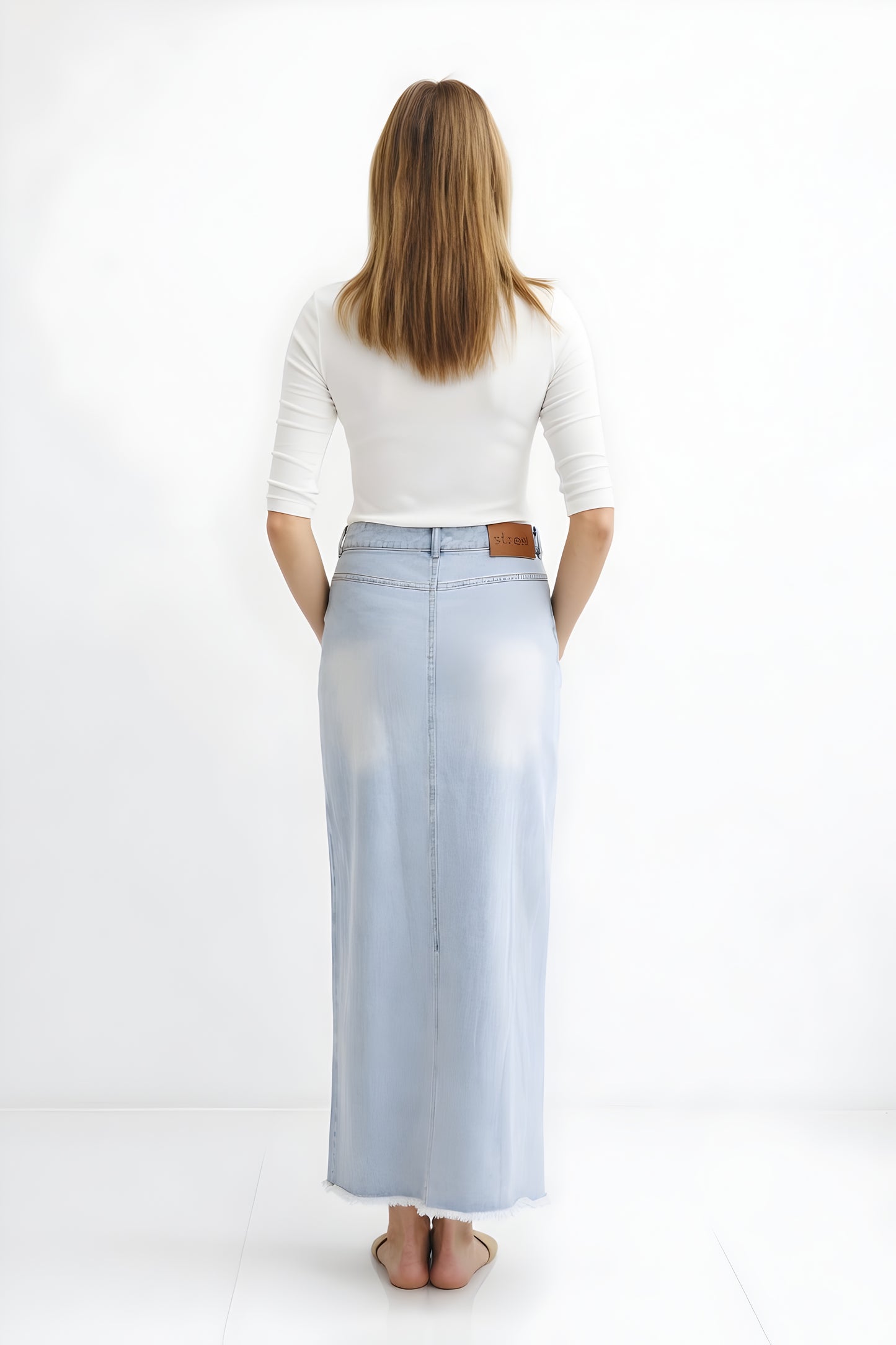 DENIM SKIRT WITH ASYMMETRICAL FLY DETAIL